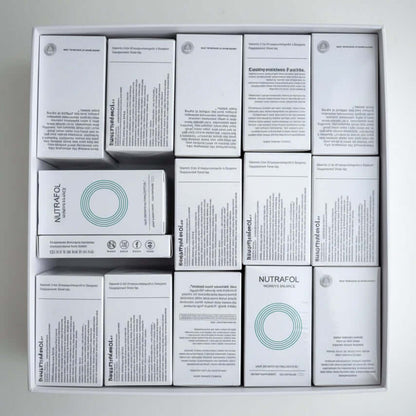 Nutrafol Women's Balance Hair Growth Support boxes arranged in a white packaging for women's hair growth supplement.